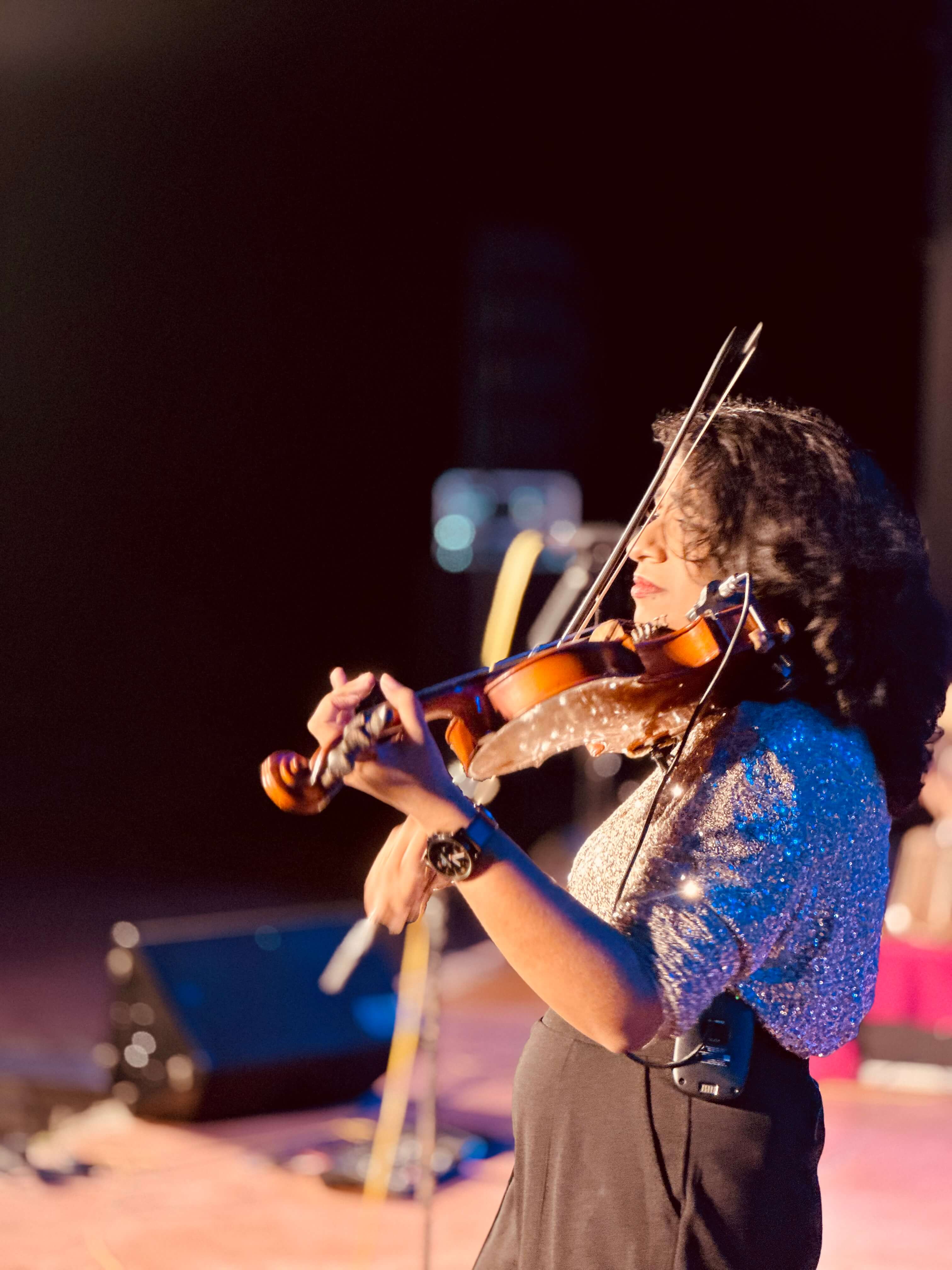 Violin close-up in blue sparkle top